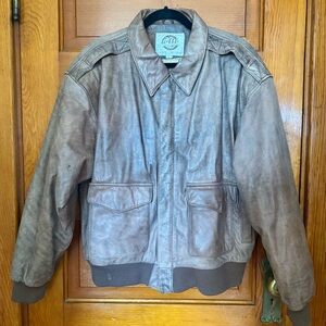 Super cool! Vintage 80's brown leather bomber jacket.